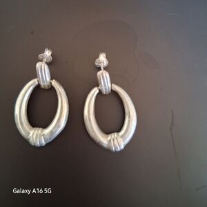 Silver plate oval drop earrings.